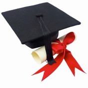 Close up of a graduation cap and a certificate with a ribbon --- Image by © Royalty-Free/Corbis